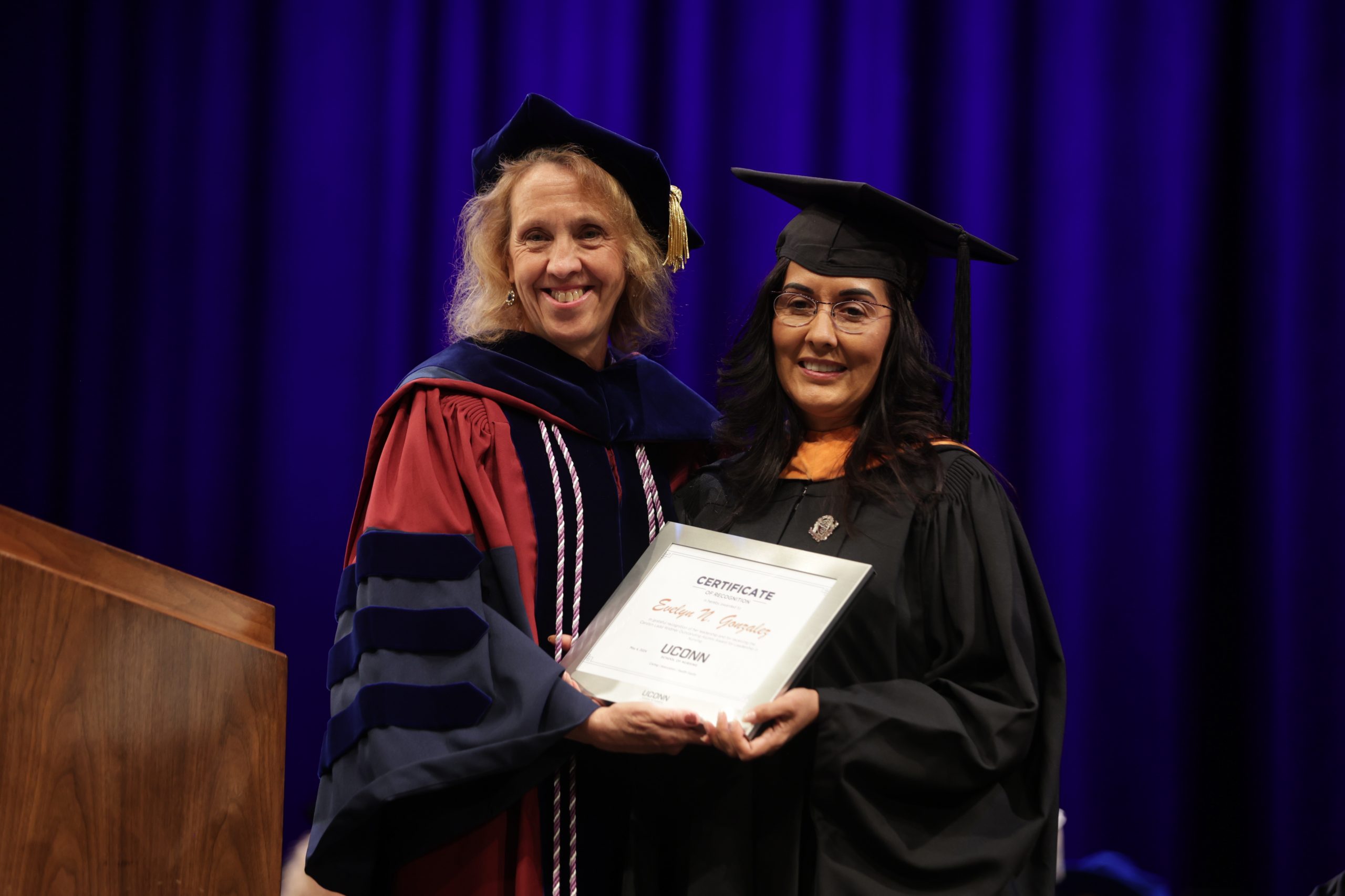 Dean Dickson with alumni award recipient at commencement 2024